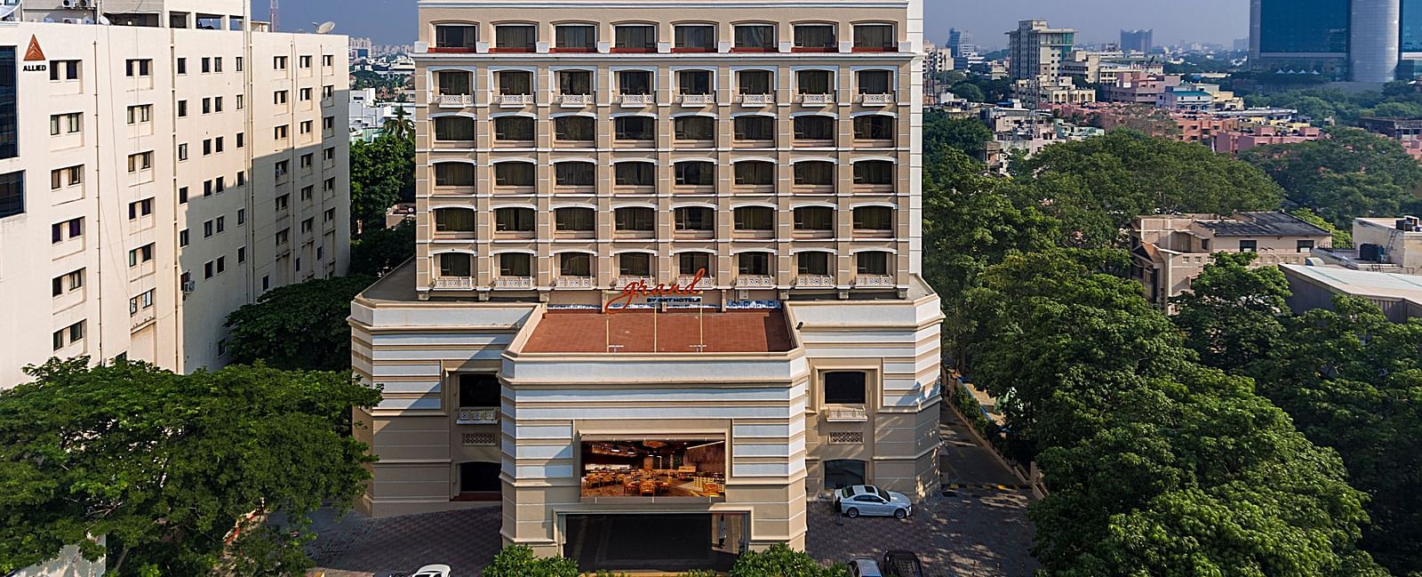 Facade view of Grand Chennai By GRT Hotels during day time.