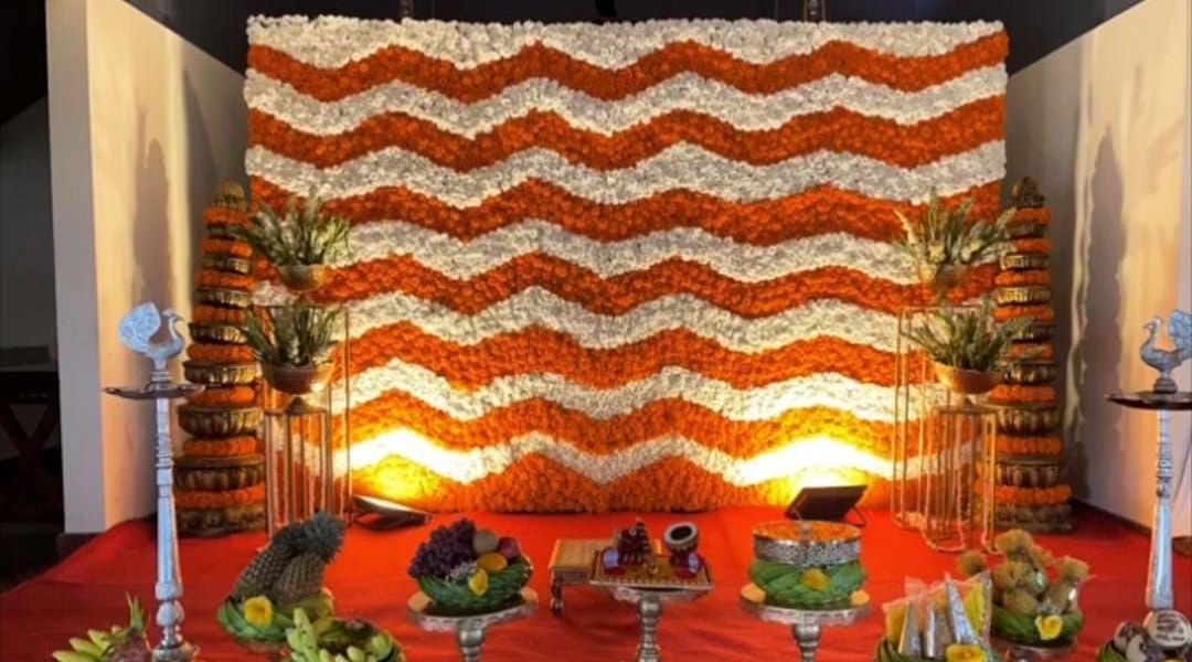 image of a well decorated stage with beautiful flowers for a wedding at the tambulam at hoysala village resort in hassan