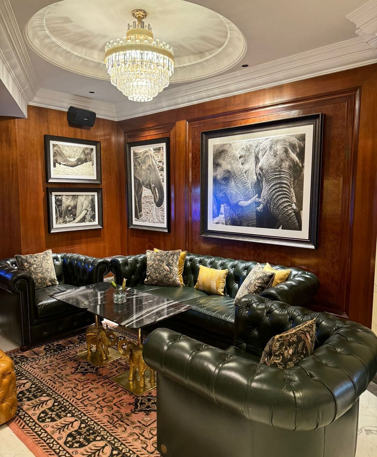 image of the elephant bar with elegant interiors and black leather couches -The Claridges New Delhi