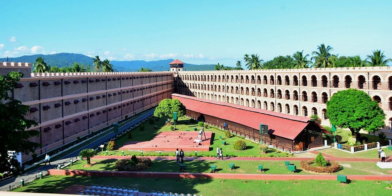 Cellular Jail in Andaman, a historic colonial-era prison with three-winged architecture, lush gardens, and a central watchtower.