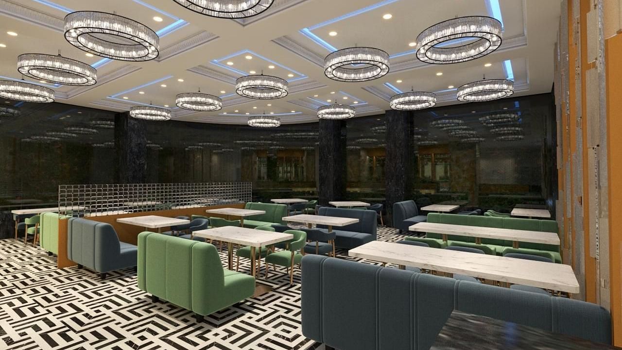 A restaurant with round, decorative lights hanging from the ceiling at Hotel Mumbai House, Vashi.