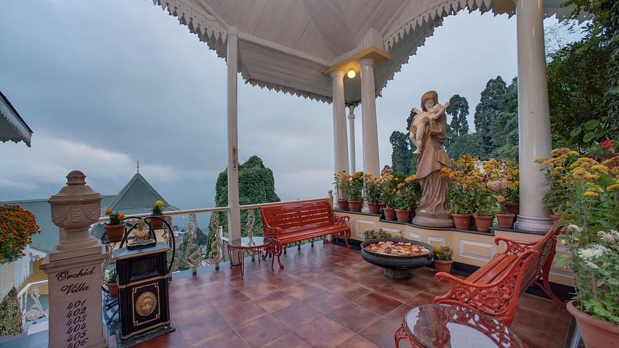 a seating space overlooking the mountains - Mayfair Hill Resort, Darjeeling