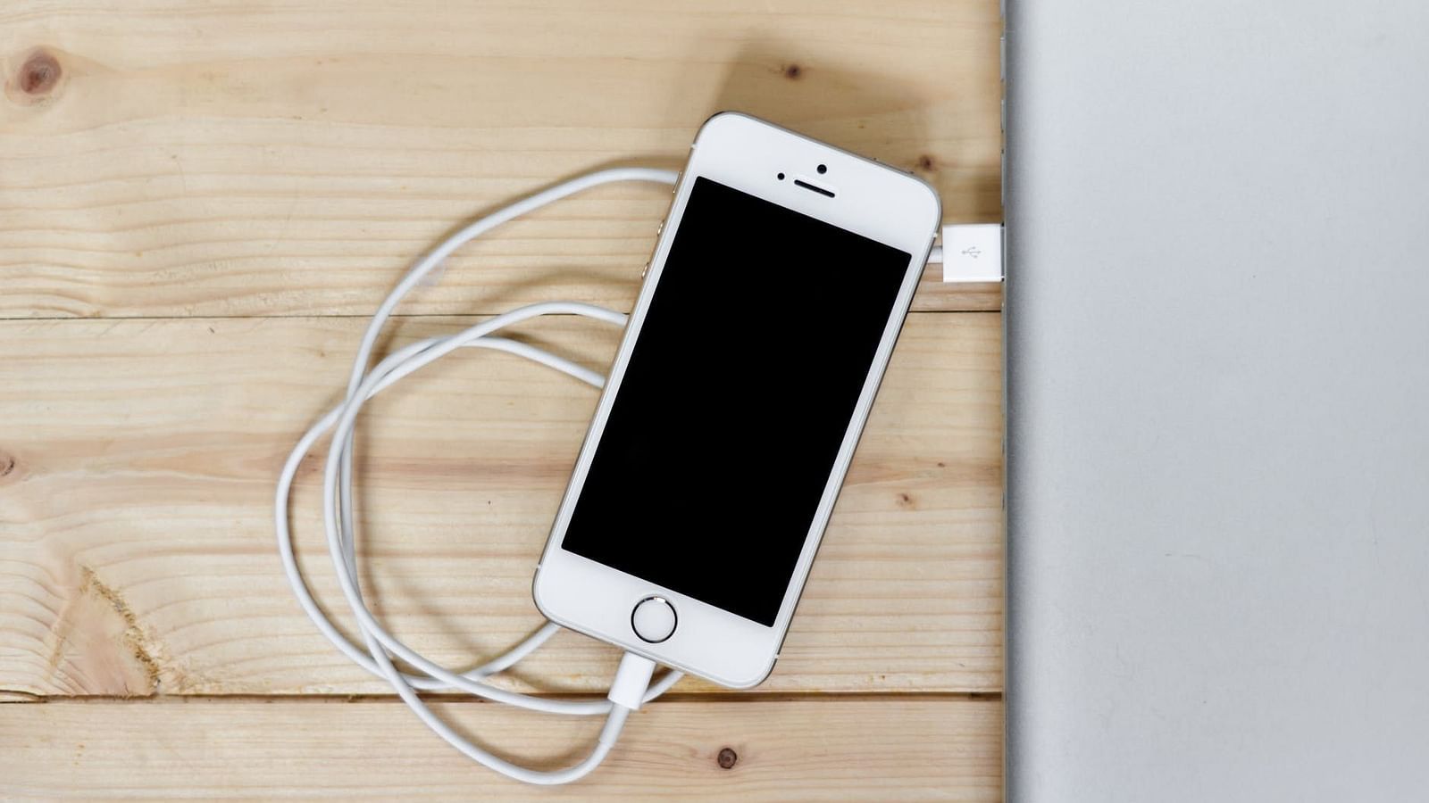 Image of a phone with a wire connected to it.
