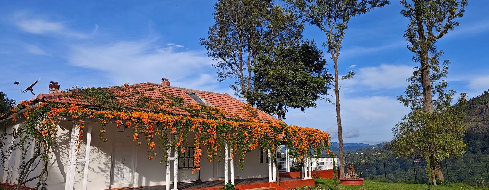 Facade image of a room in the daylight with a well in front of it - Ibex Stays & Trails, Coonoor (Leewood).