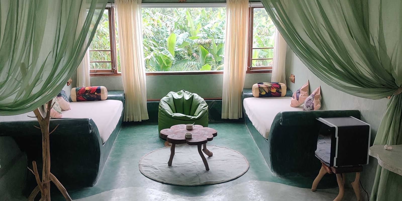 Trevally-Spacious and exclusive Premium Trevally Room with large windows revealing picturesque views of Matsya Island.