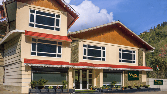 Exterior view of a resort under a bright blue sky | Voyage Rodhi Resort