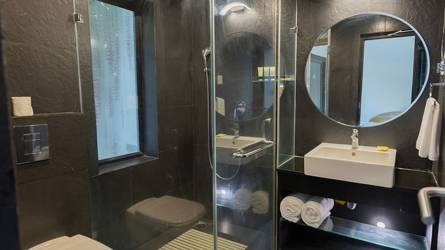 image of a luxurious bathroom with a fully stocked vanity area of the garden room - Darza Resorts