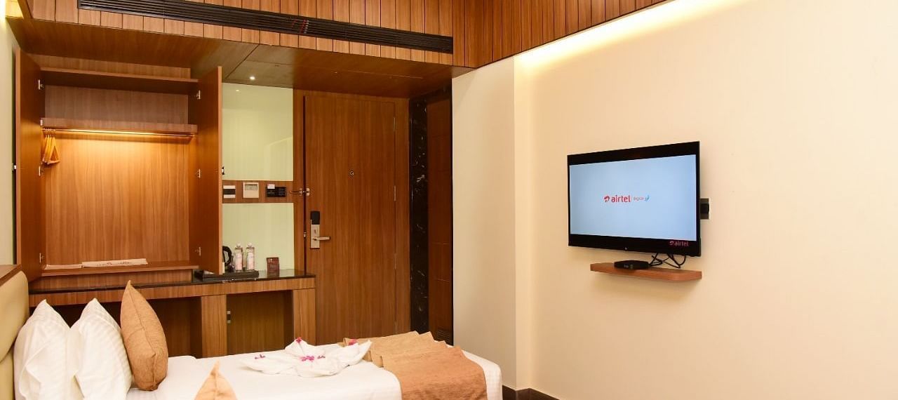 Twin beds with an LCD Television at TGI Felicity, Bangalore