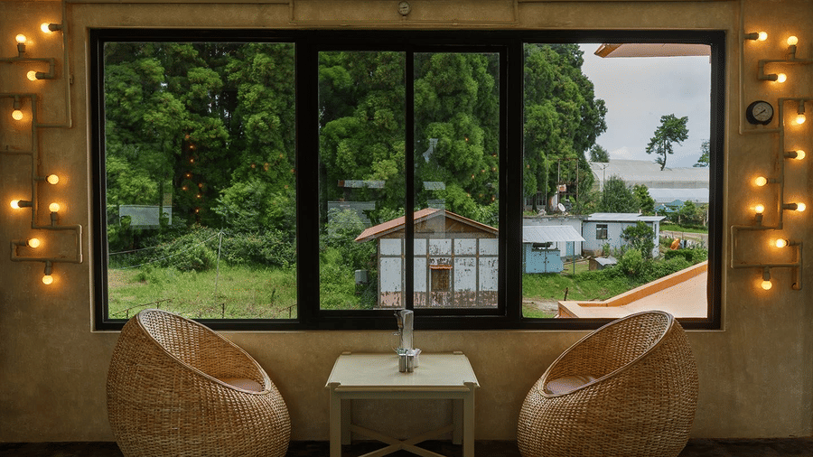 a seating area beside a window overlooking nature