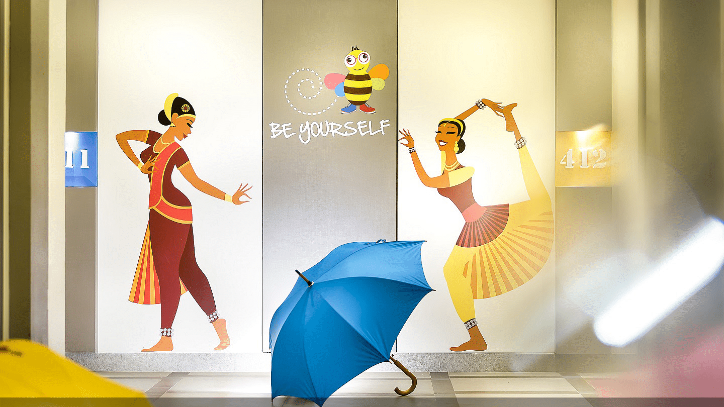 Two women performing Bharatanatyam are painted on the wall