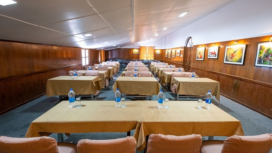 Row-wise seating arrangements with stylish interior design at The Pavilion, Nainital