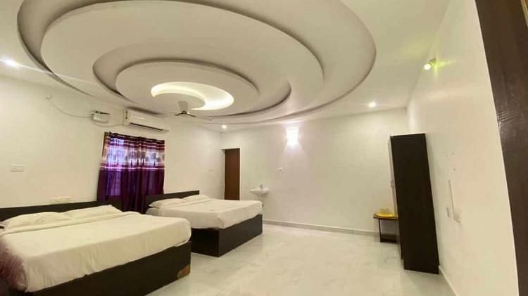 Room with twin beds at La Paradise Luxury, Pondicherry