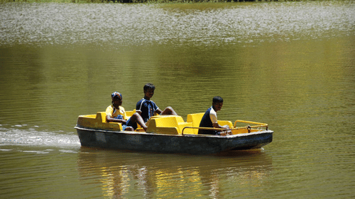few people inside a rowing boat during a Lake Ride at Black Thunder, Coimbatore