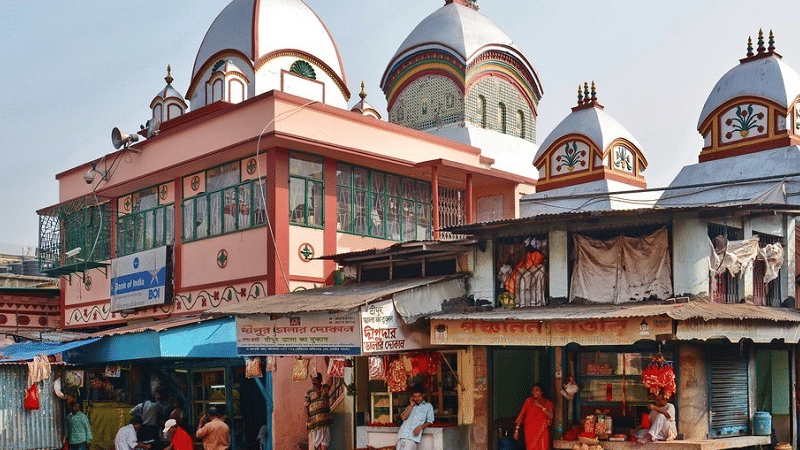 Vibrant street near a temple in Kolkata with local shops and cultural architecture reflecting the city’s lively atmosphere and heritage