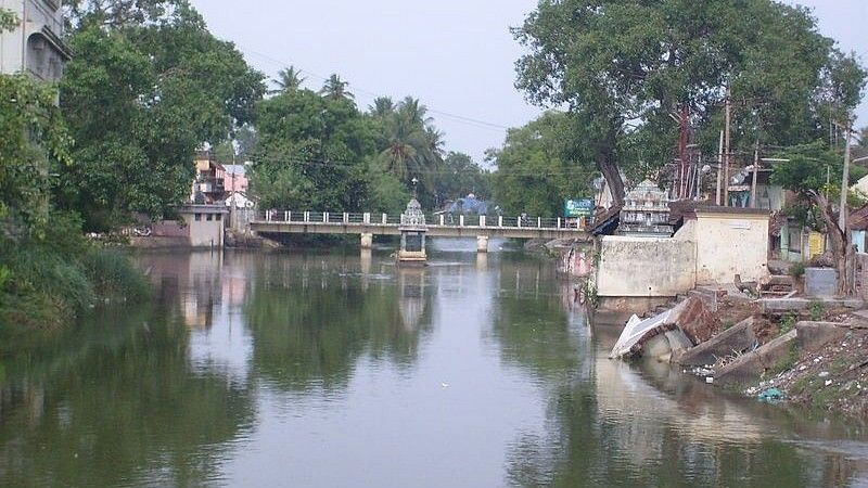 An image Kaveri Bridge Mayiladuthurai with flowing water and trees around it , Amanvana Resort Spa, Places To Visit in Coorg
