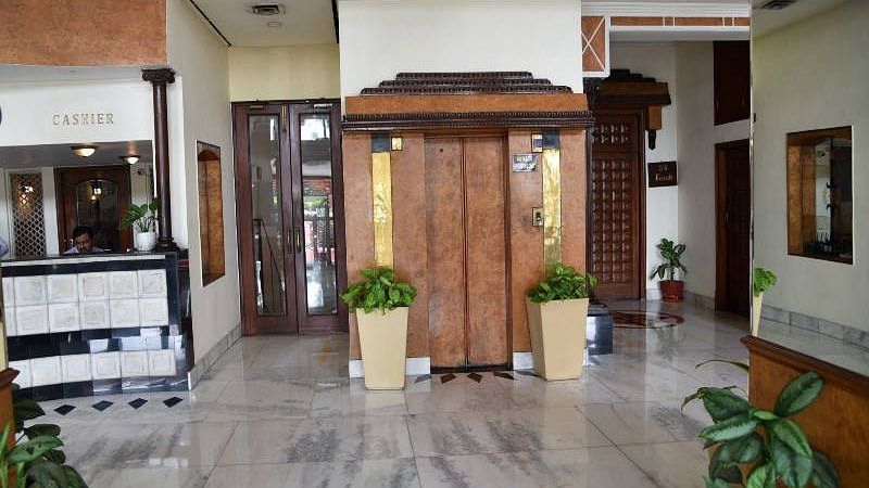 The elevator at Hotel Gold, Panipat besides the reception desk.