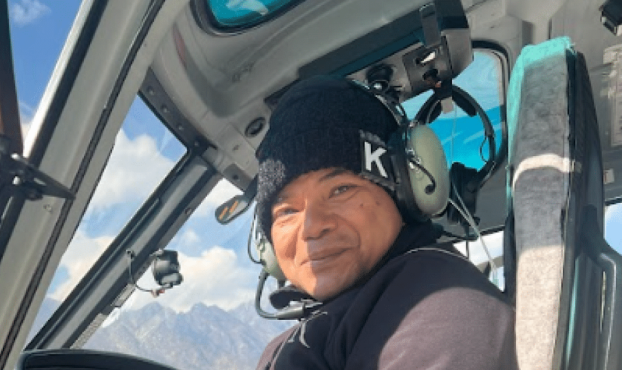 An image of a man inside the helicoper | Kavya Resort and Spa, Nagarkot