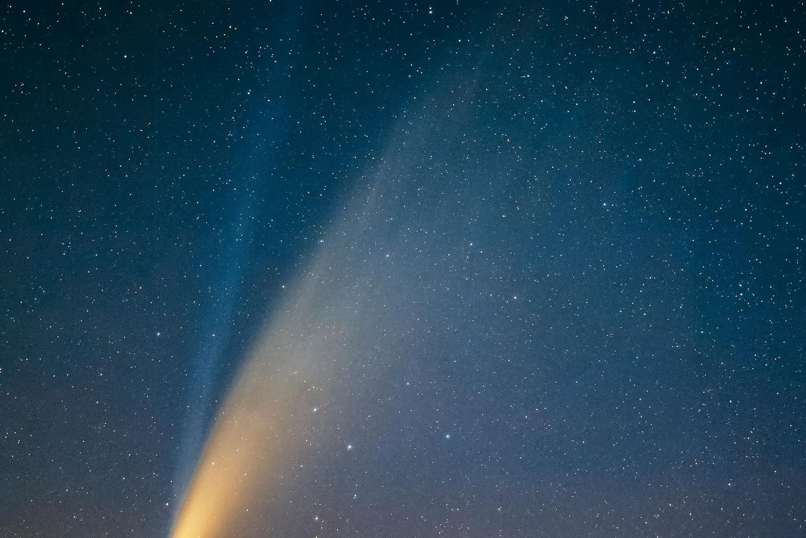 A bright streak of light against a dark background.