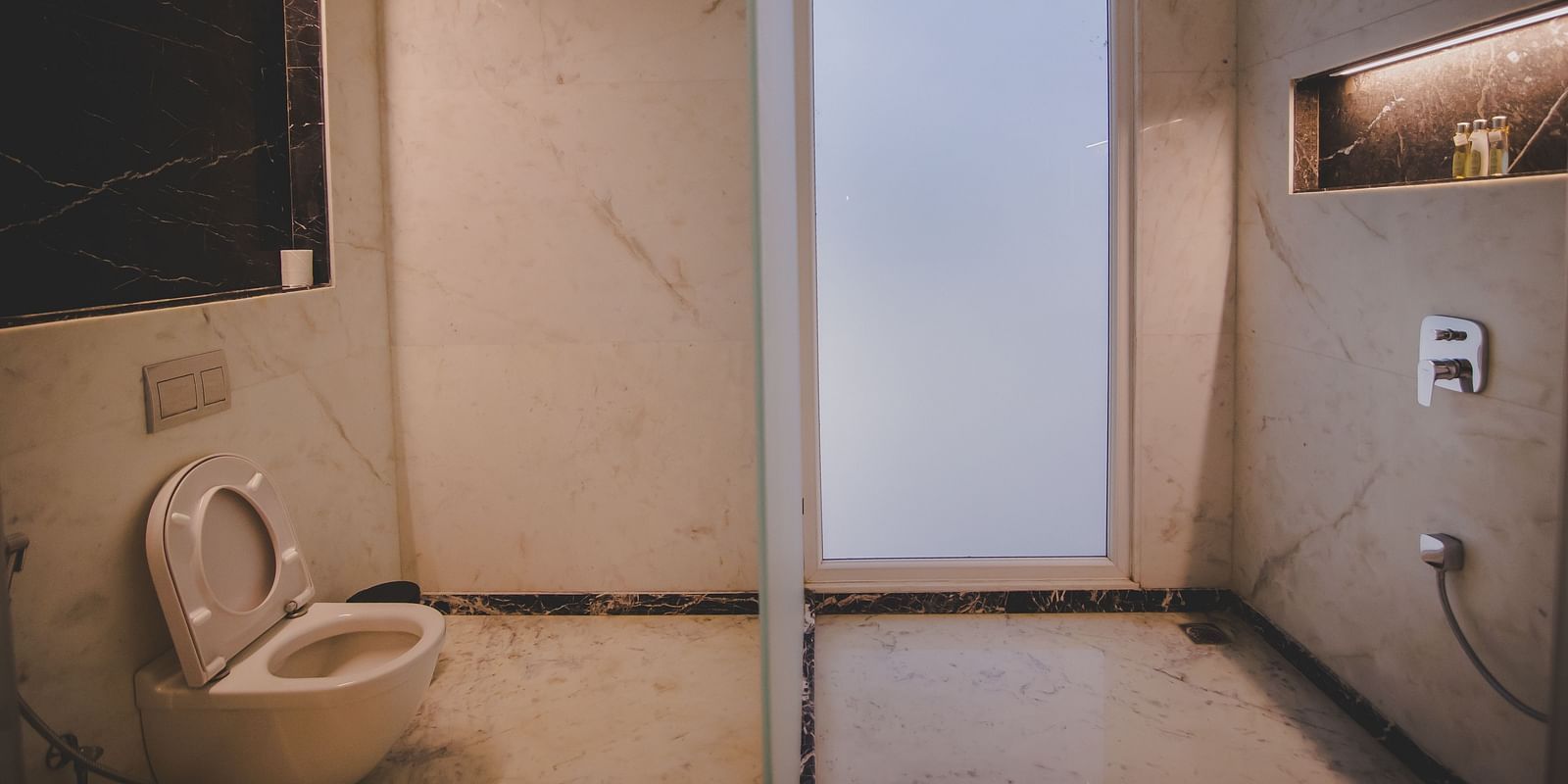Image of a washroom with a toilet at Rajasthali Resort & Spa Jaipur.
