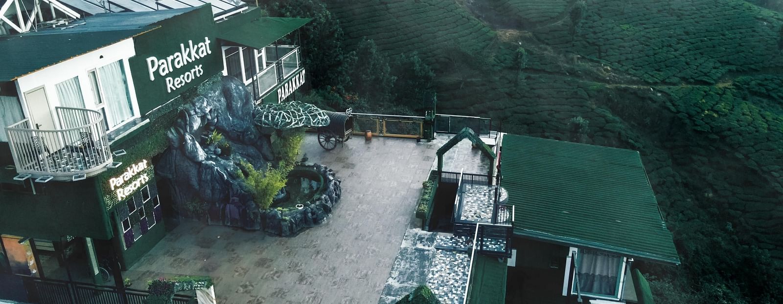 View of the Facade of Parakkat Nature Hotel and Resorts, Munnar amidst the fog 
