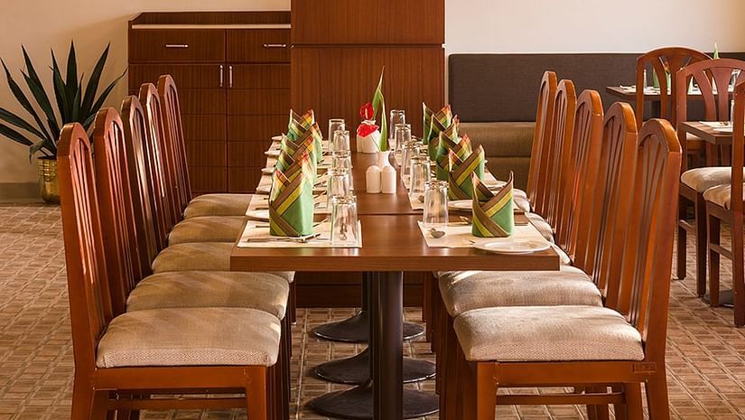 An overview of the seating arrangement inside the best multi-cuisine restaurant in Munnar - Abad Copper Castle.