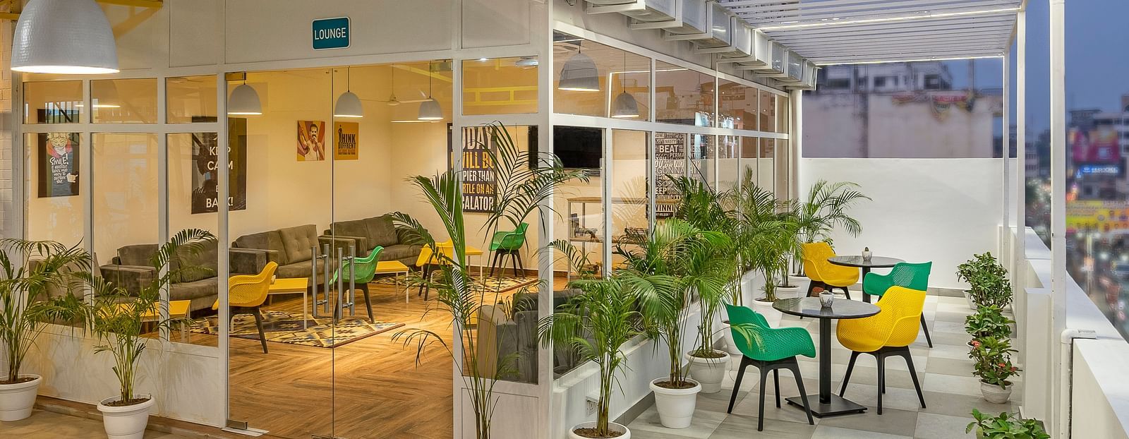 Modern recreational lounge with open rooftop and stylish seating arrangement.