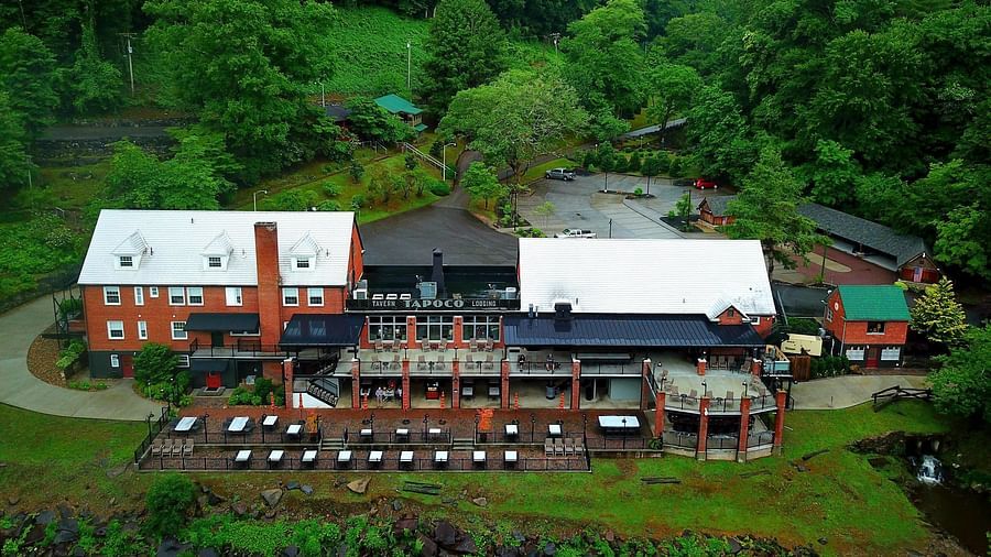 bird eye view of our resort featuring a beautiful mountain covered by green vegetation in the background - Historic Tapoco Lodge