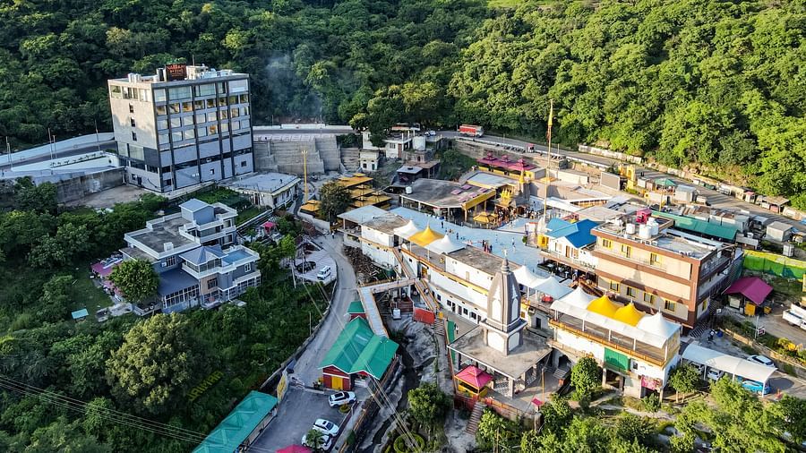 An image of our hotel building with vibrant mountains surrounding it - NAMAMI BY ZENQ BANKHANDI