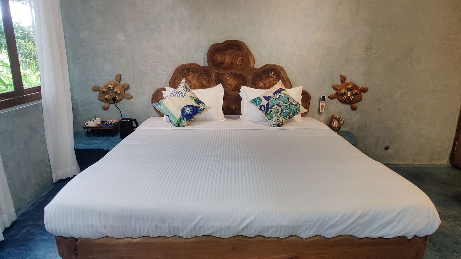 Luxurious Ocean Room, 266 sq. ft., with a king-size bed and a rug below it ensuring comfort and luxury at its best.