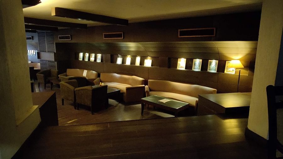 A dimly lit indoor seating area at 24 Karats bar - Hotel Gold, Panipat