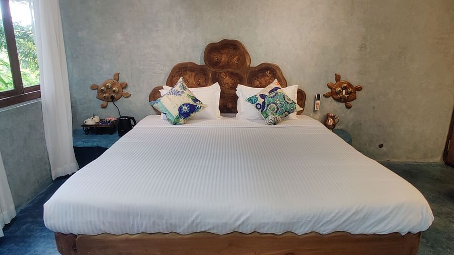 Luxurious Ocean Room, 266 sq. ft., with a king-size bed and a rug below it ensuring comfort and luxury at its best.