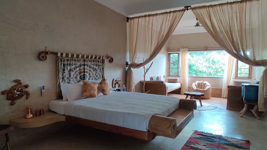 King-size bed and big windows that provide a glorious glimpse into the outside world.
