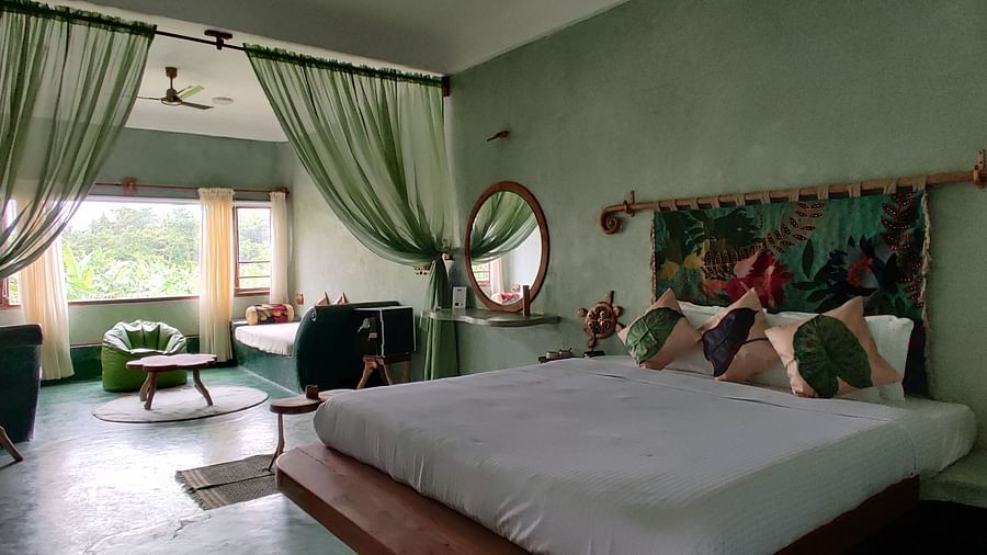Bed in the room beside a living room | Matsya Island Retreat