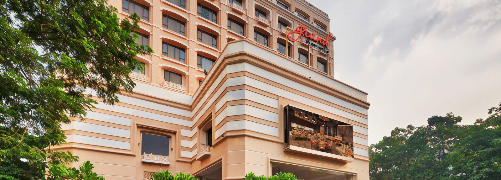 Facade of Grand Chennai By GRT Hotels during daytime.
