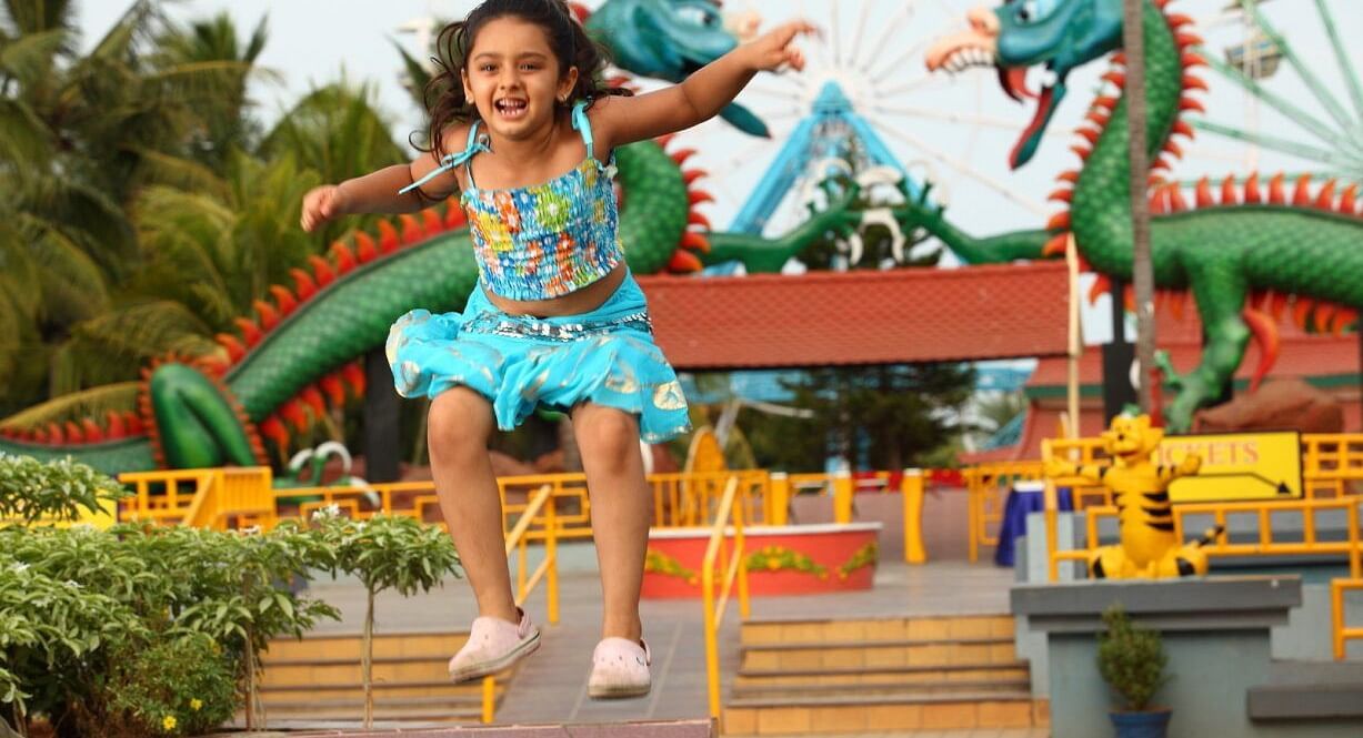 a kid jumping in the air at MGM Dizzee World