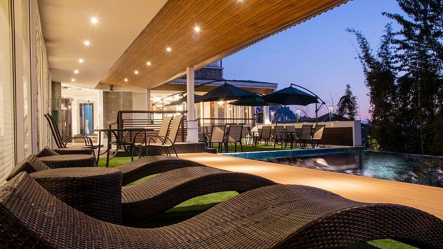 A close up shot of the sun loungers placed by the pool - Summit North Star, Gangtok