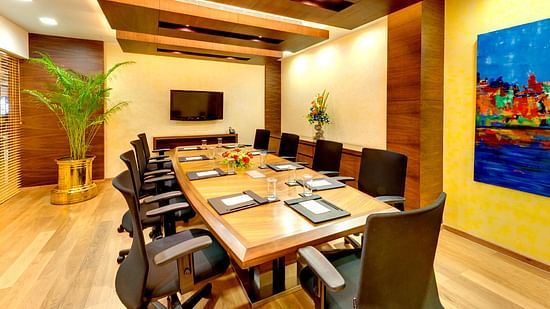 a meeting room table with chairs in a business centre - Kenilworth Hotel, Kolkata