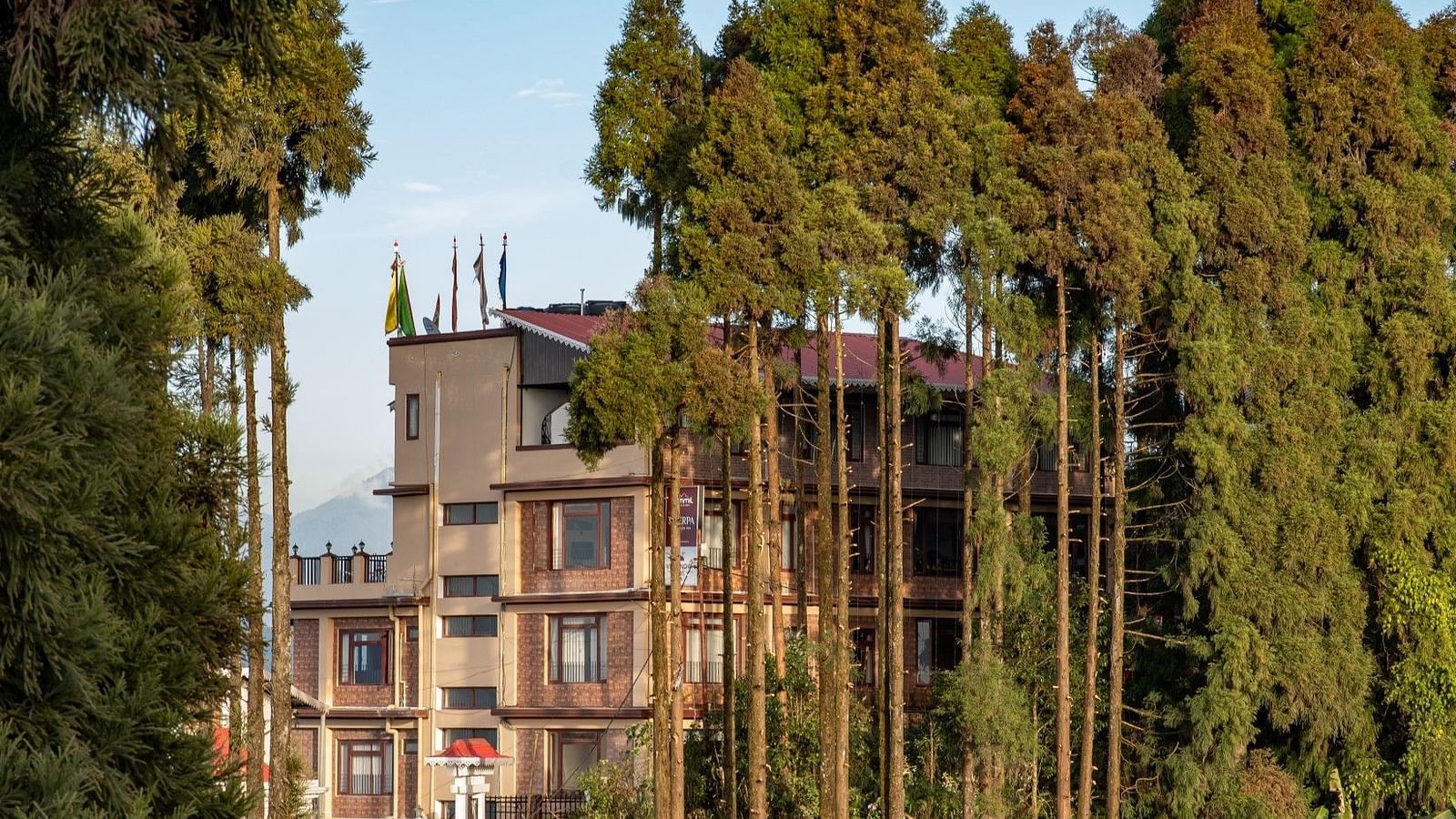Facade of Image of lush mountain range with trees at Summit Sherpa Mountain Hotel & Spa, Kalimpong