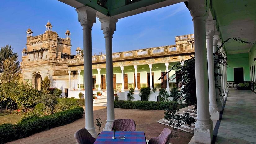 outdoor seating area with view of the lawn at The Piramal Haveli - 20th Century, Shekhavati
