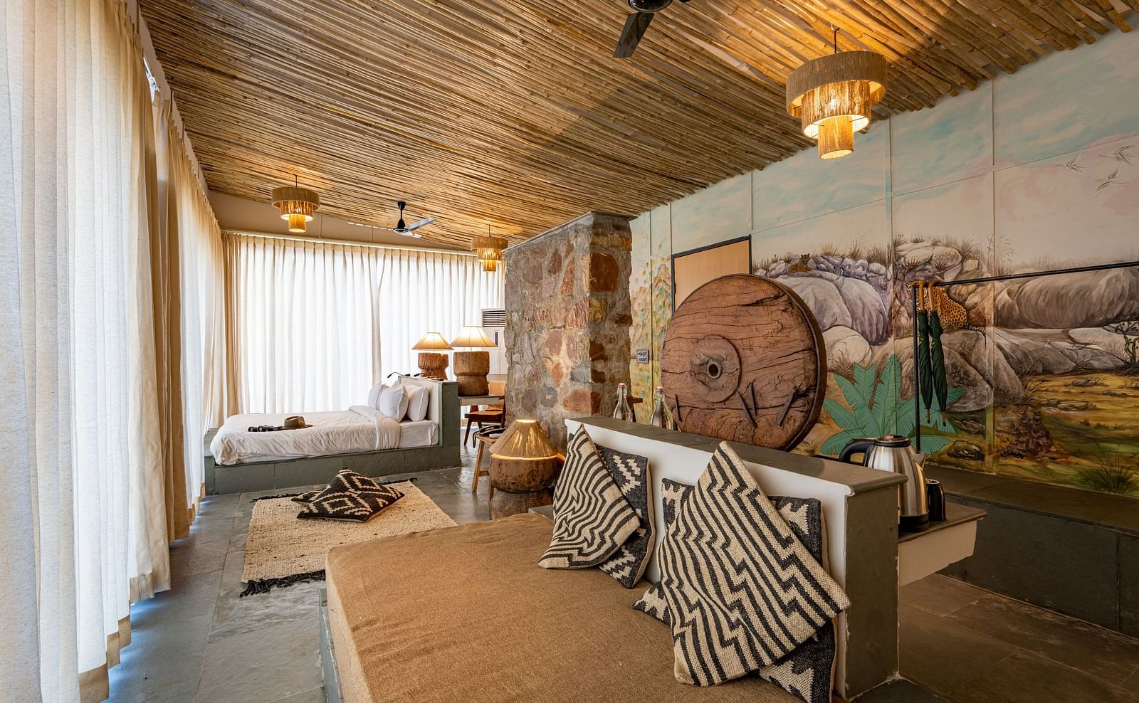 A view of our Forest Bungalow with comfortable sofas and large bed - Utsav Camp