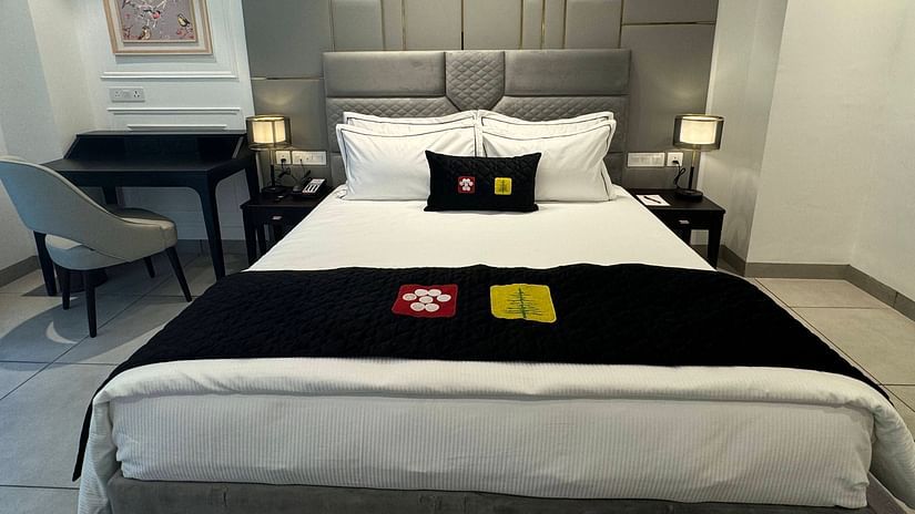an image of a super deluxe room with a working table and a chair at Mastiff Select Mandavya Dharamkot, McLeodganj