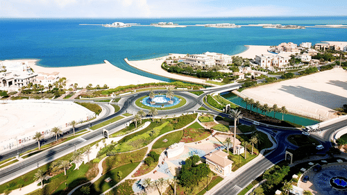 Aerial view of Doha's coastline with the ocean in the background - La Maison Hotel, Doha