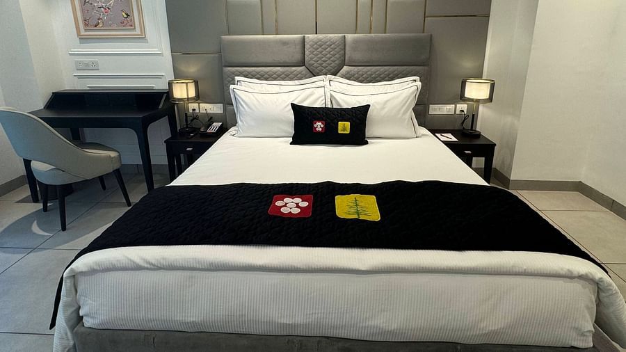 an image of a super deluxe room with a working table and a chair at Mastiff Select Mandavya Dharamkot, McLeodganj