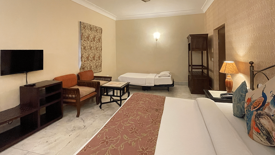 A double and a single bed in the Deluxe triple room at Suryaa Villa Jaipur