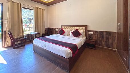 Luxury Cottage with a large bed at DLS MJ River Resort, Rishikesh.