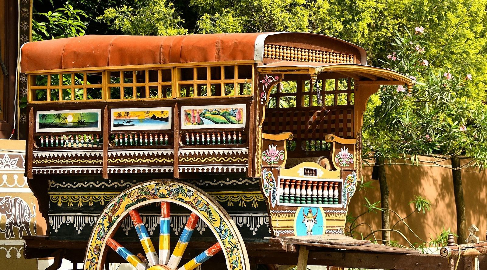 image of a wooden bullock cart at hoysala village resort, hassan
