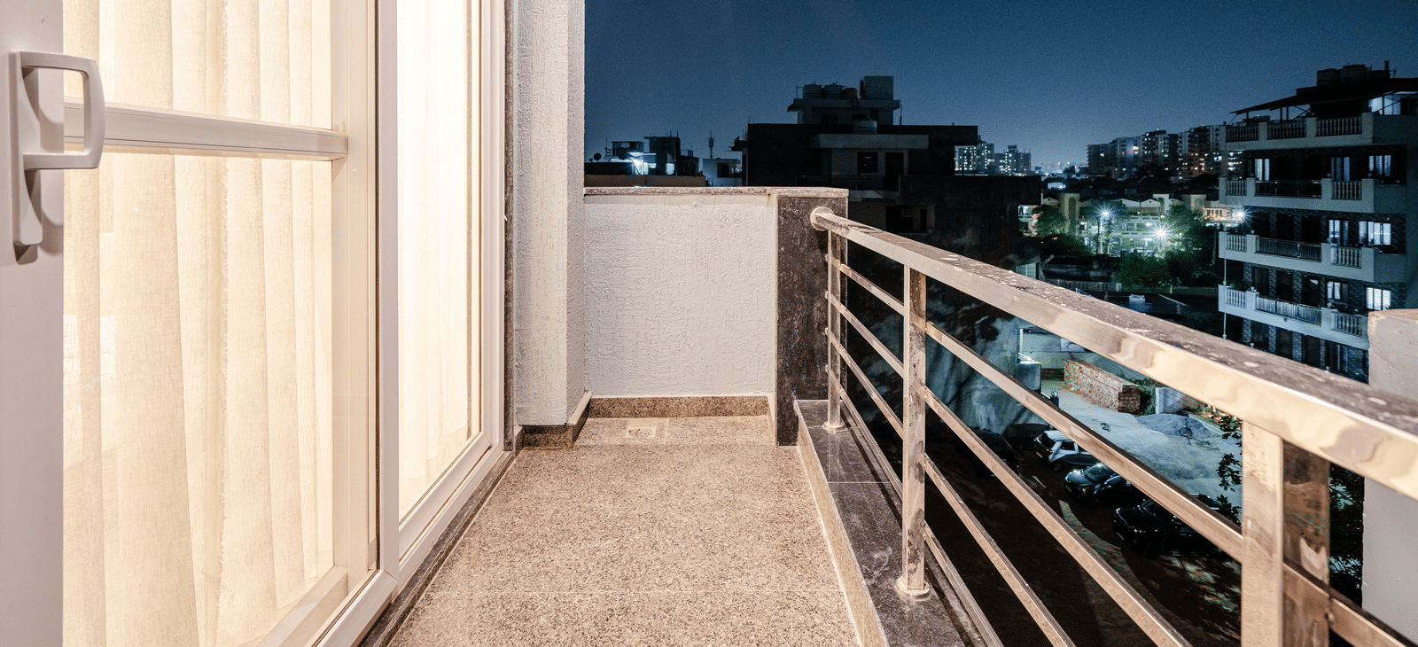 Private balcony offering city views from the apartment at Lime Tree 1BHK Service Apartment Near Artemis Hospital Gurgaon.