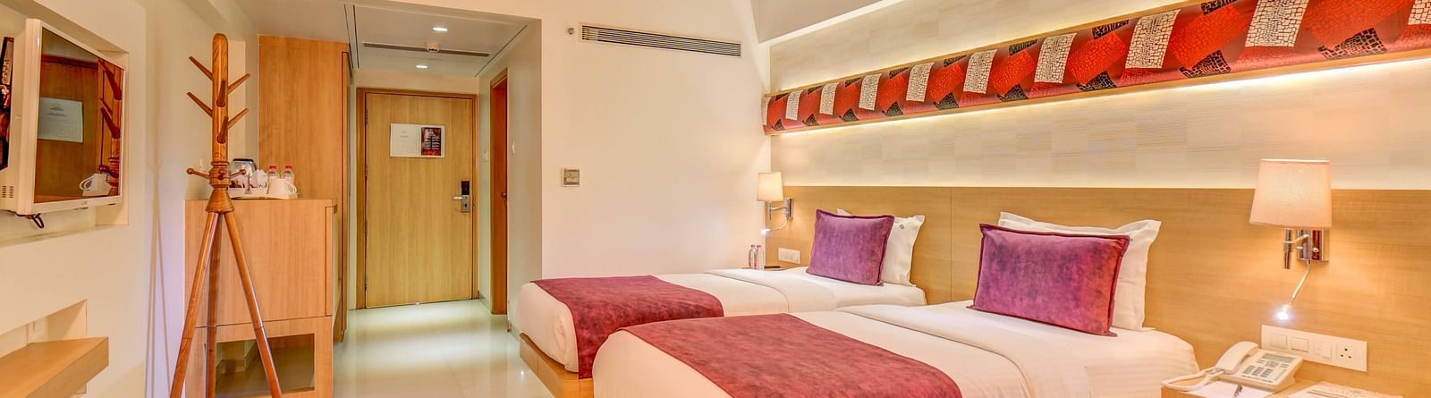 a view of the twin bed at Premium room at The SSK Solitaire Hotel & Banquets, Mumbai Naka - Nashik