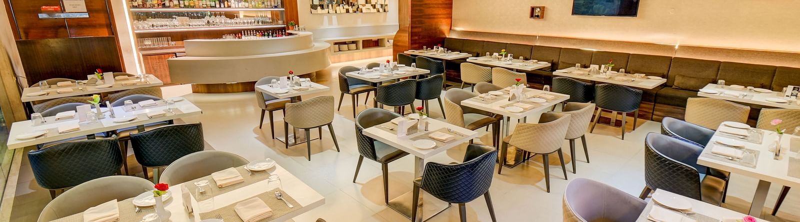 Elegant indoor restaurant dining area of House of Flavour at The SSK Solitaire Hotel & Banquets, Mumbai Naka - Nashik
