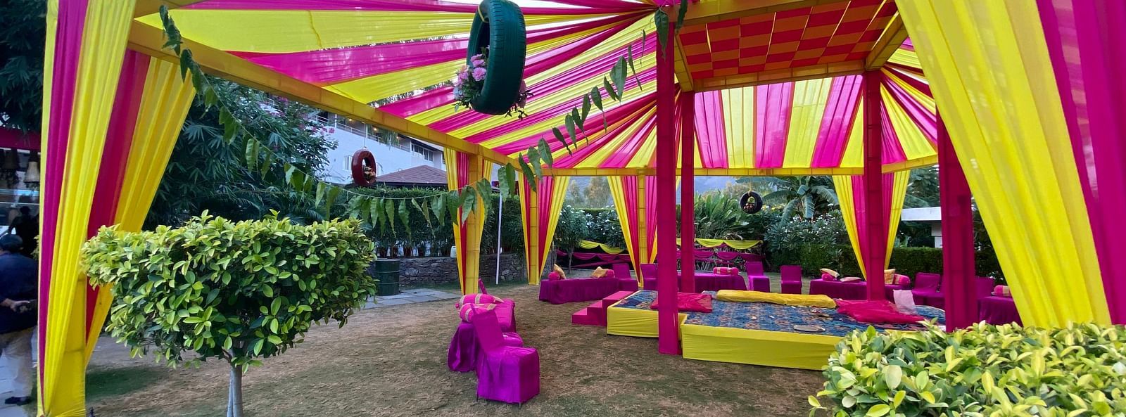 Tent with a stage as a setting.